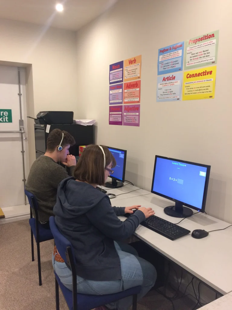 Adult learners using computers at the centre