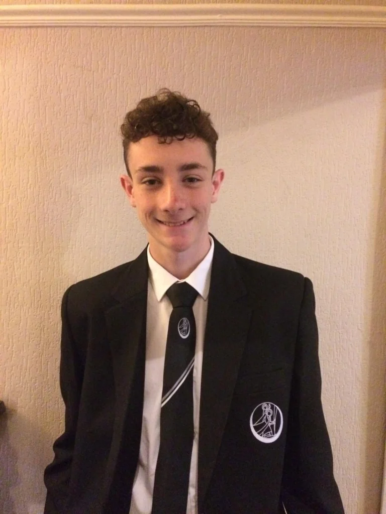 Past student Sam in his school uniform