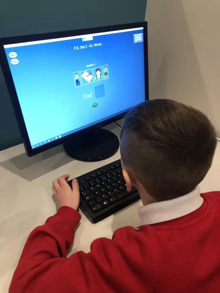 Pupil doing a phonics activity on a computer